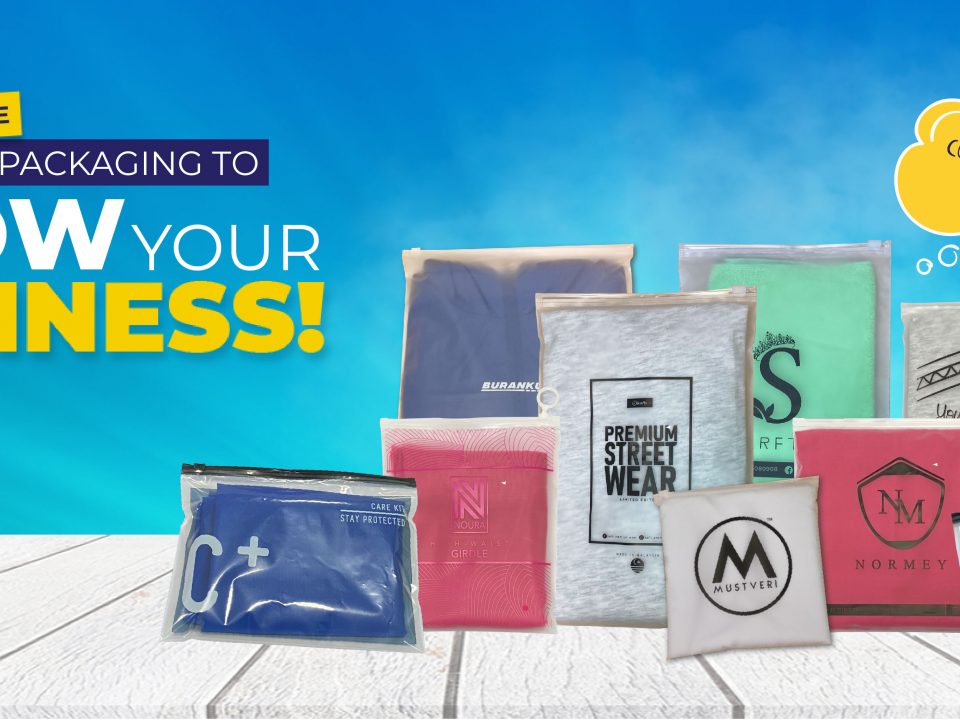 A product image with a bright blue sky background, an arrangement of plastic pouches on a white wooden table or surface for product display, and a