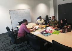 HAIN Packaging design team meeting with colorful packaging samples on table